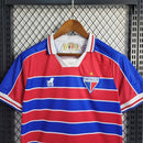 Camiseta de aficionado del León de Fortaleza I 23/24 para hombre - Roja y azul