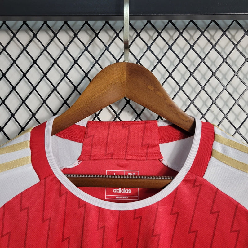 Camiseta de aficionado Adidas para hombre del Arsenal I 23/24: roja y dorada.