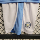 Camiseta y pantalón corto azul del Manchester City 23/24 para niño